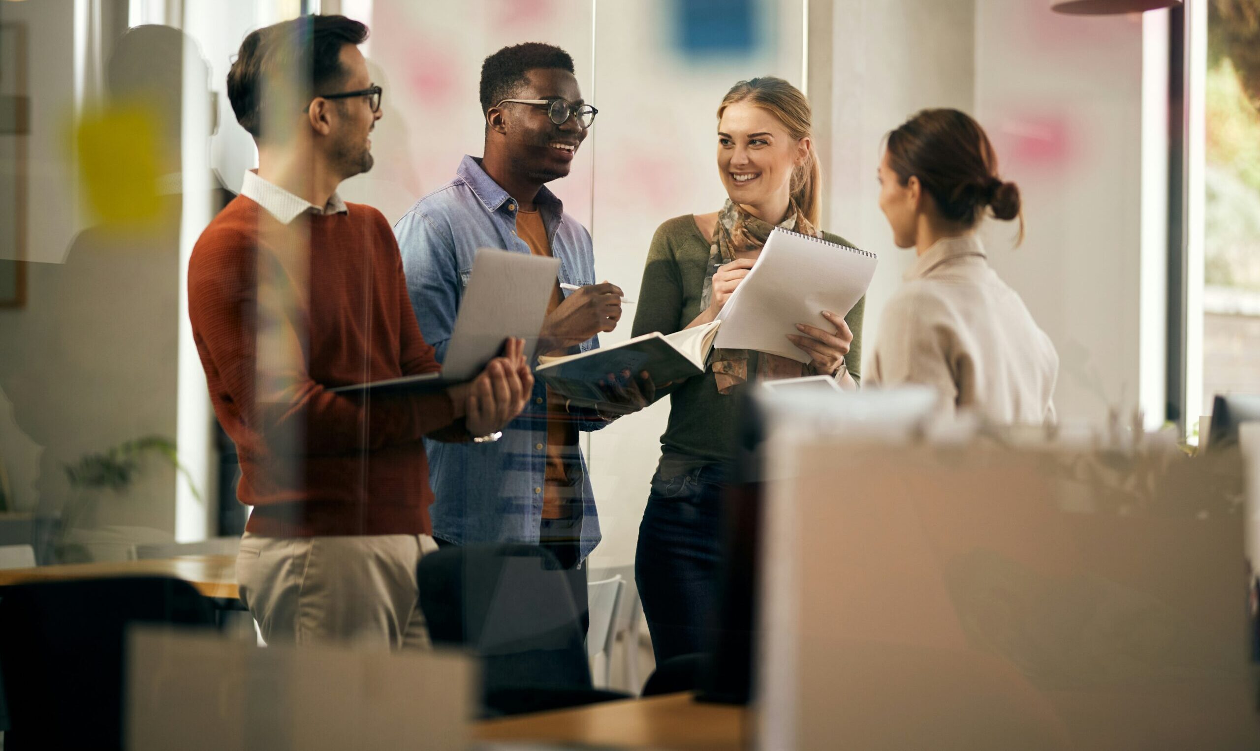 Group of coworkers laughing at work