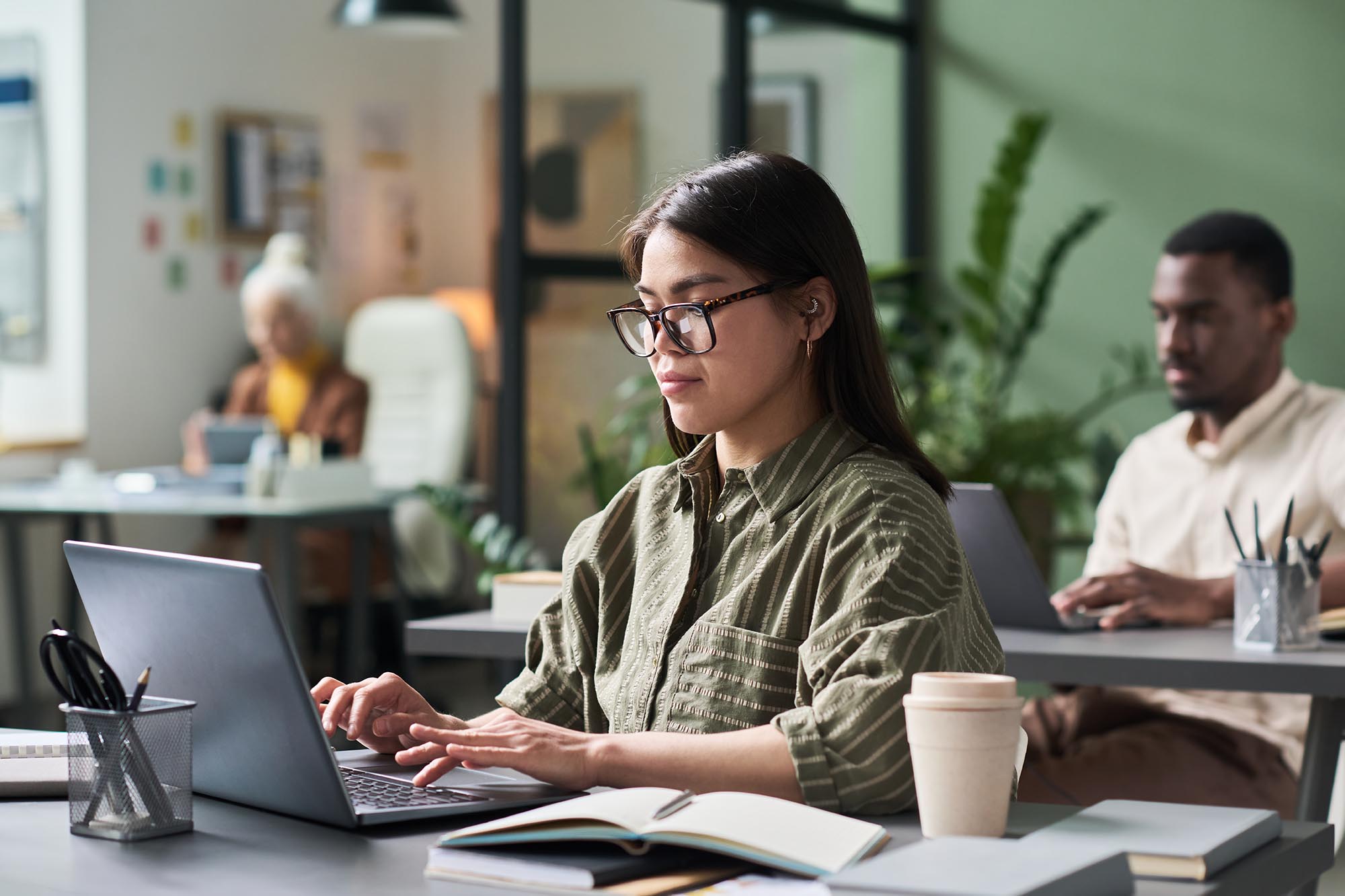 Finance professional using Trintech AI financial close software in office environment to manage reporting